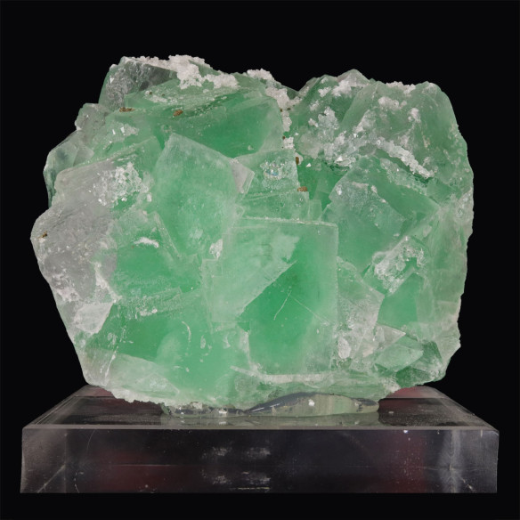 Fluorite sprinkled with quartz (Morocco) displayed on base.