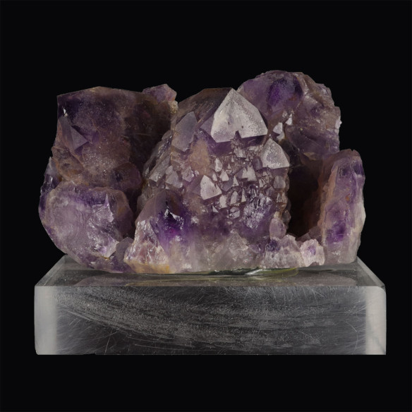 Moroccan amethyst on an acrylic stand, front view of the purple crystal cluster