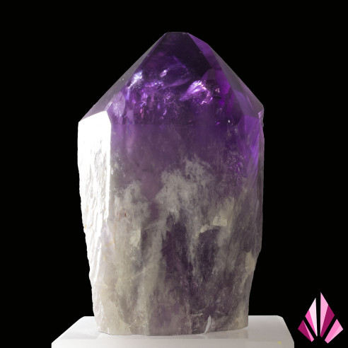 Brazilian amethyst crystal with a purple termination presented on an acrylic stand