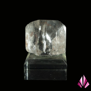 Clear topaz crystal from Minas Gerais, Brazil, displayed on an acrylic base